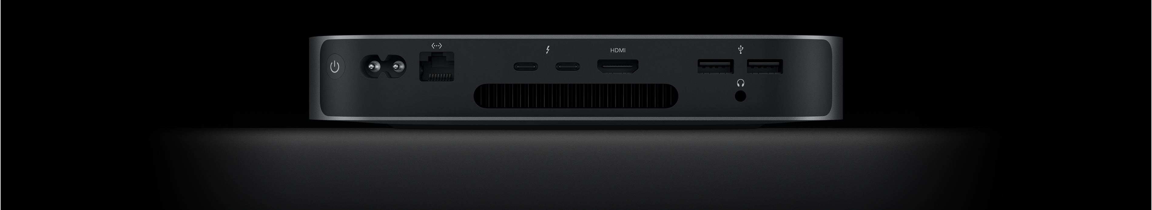 Back view of Mac mini showing the two Thunderbolt 4 ports, HDMI port, two USB-A ports, headphone jack, Gigabit Ethernet port, power port and power button.